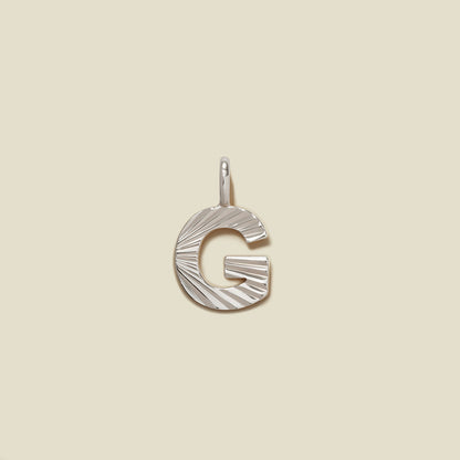 Initial G Charm